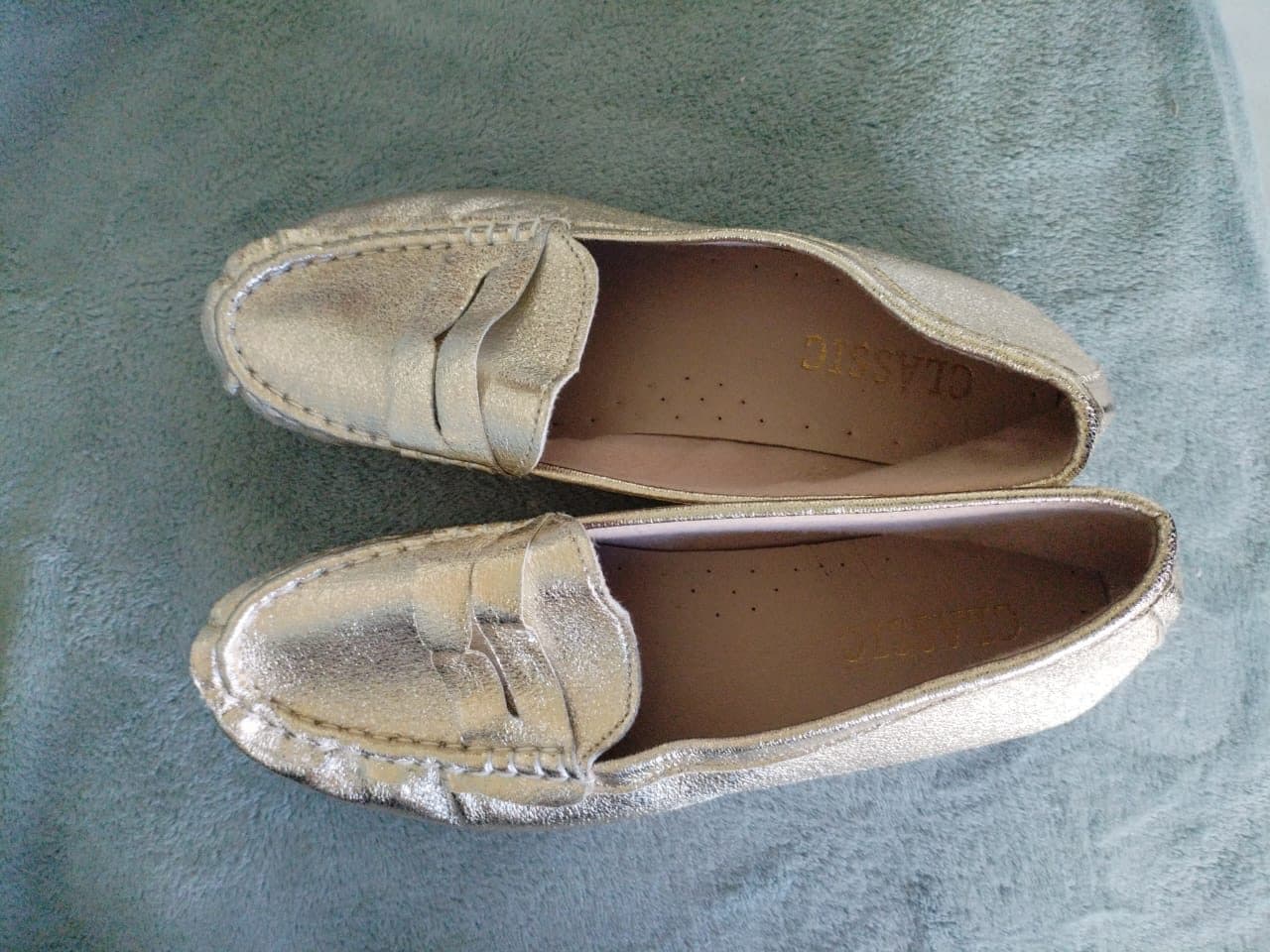 Metallic gold penny loafers